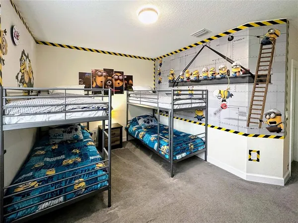 a bedroom with furniture and a baby crib