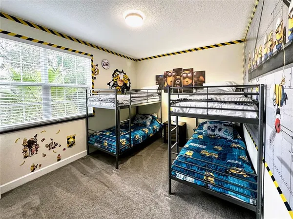 a bed room with furniture and a window