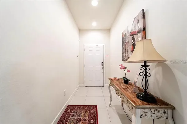a view of hallway with a small kitchen