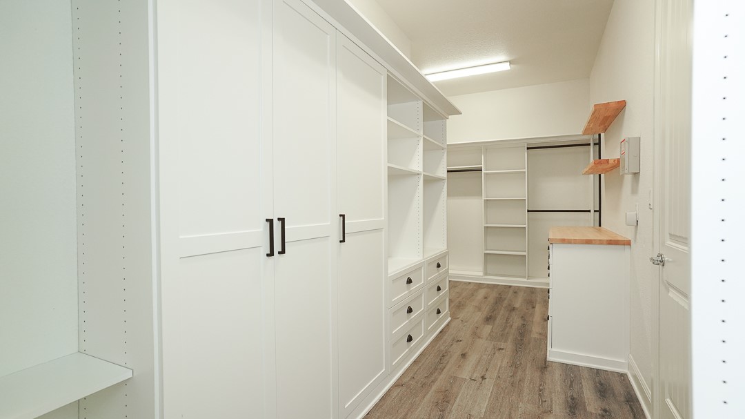 629 Germander Road Leander, TX 78641 - Photo 23 of 32 Ample storage solutions are provided by the well-organized walk-in closet featuring built-in cabinetry and shelves.