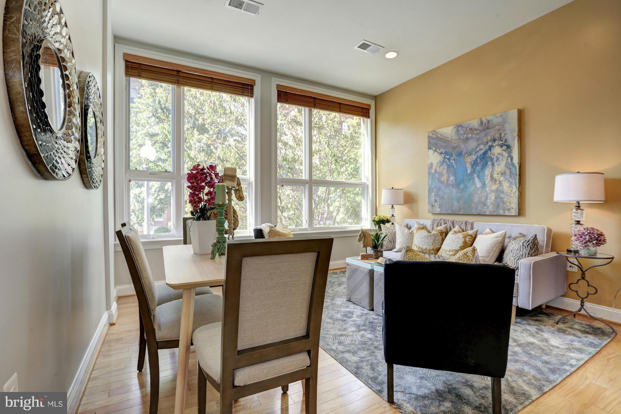 1407 W Street Northwest, Unit 202 Washington, DC 20009 - Photo 11 of 30 a dining room with furniture and window