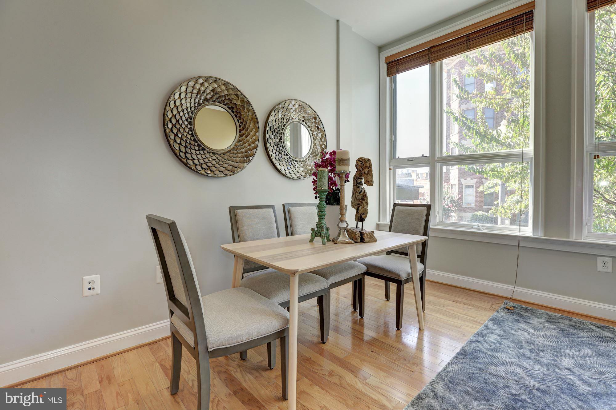 1407 W Street Northwest, Unit 202 Washington, DC 20009 - Photo 15 of 30 a view of a dining room with furniture and window