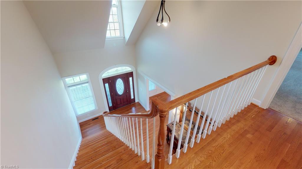 256 Stonecroft Road Mount Airy, NC 27030 - Photo 21 of 30 View from upstairs catwalk down to foyer. Oak hardwood floors.