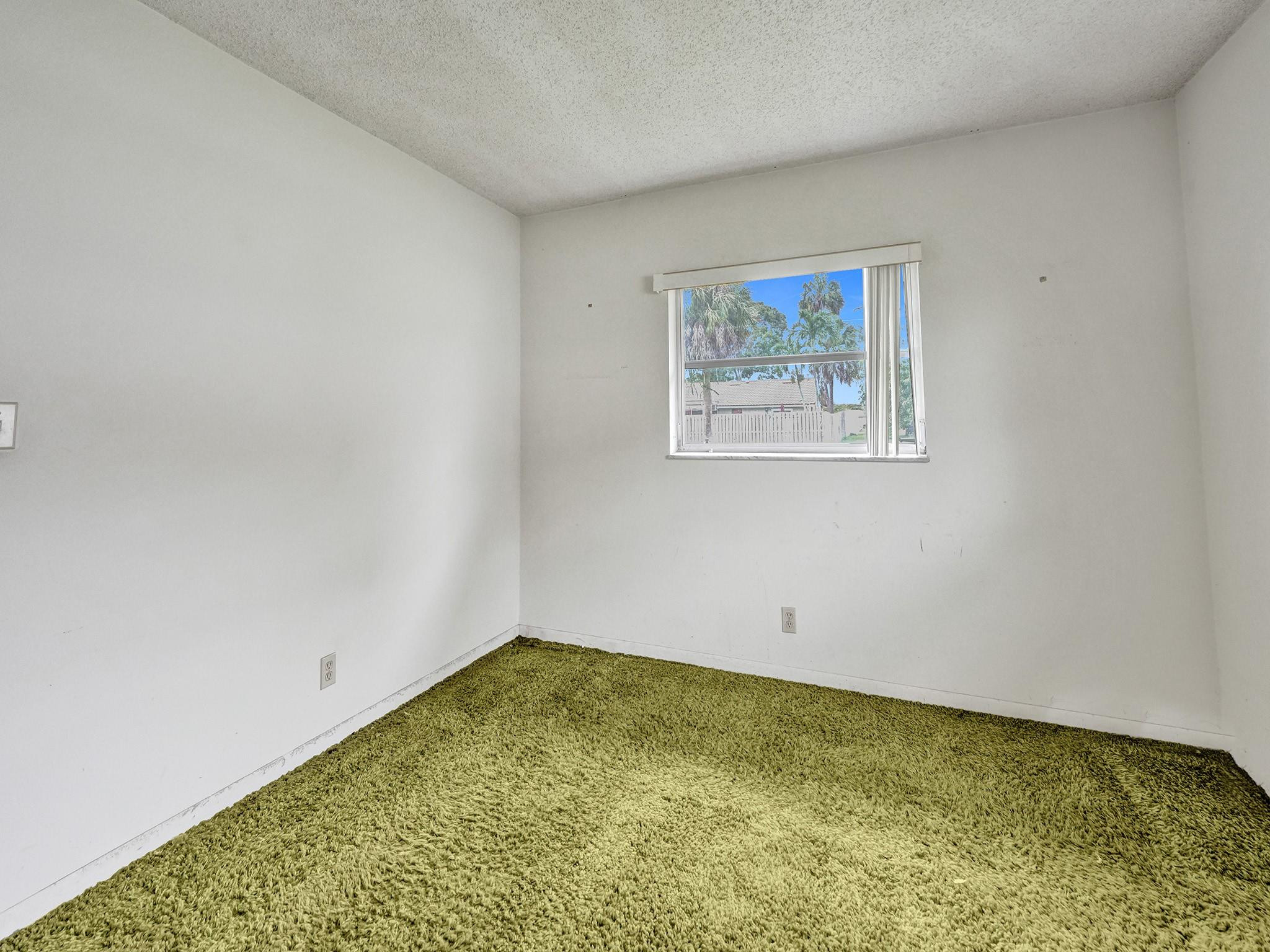 22062 Acapulco Court Boca Raton, FL 33428 - Photo 23 of 39 Bedroom #2 window looking into Backyard