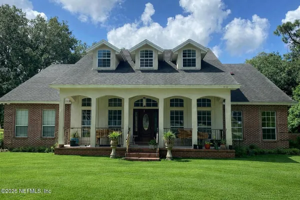 front view of a house with a yard