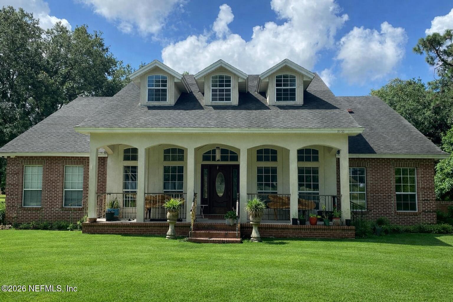 8500 Wagenhals Road Jacksonville, FL 32210 - Photo 1 of 1 front view of a house with a yard