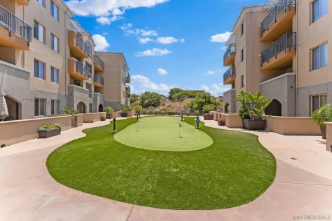 a view of a swimming pool with a back yard