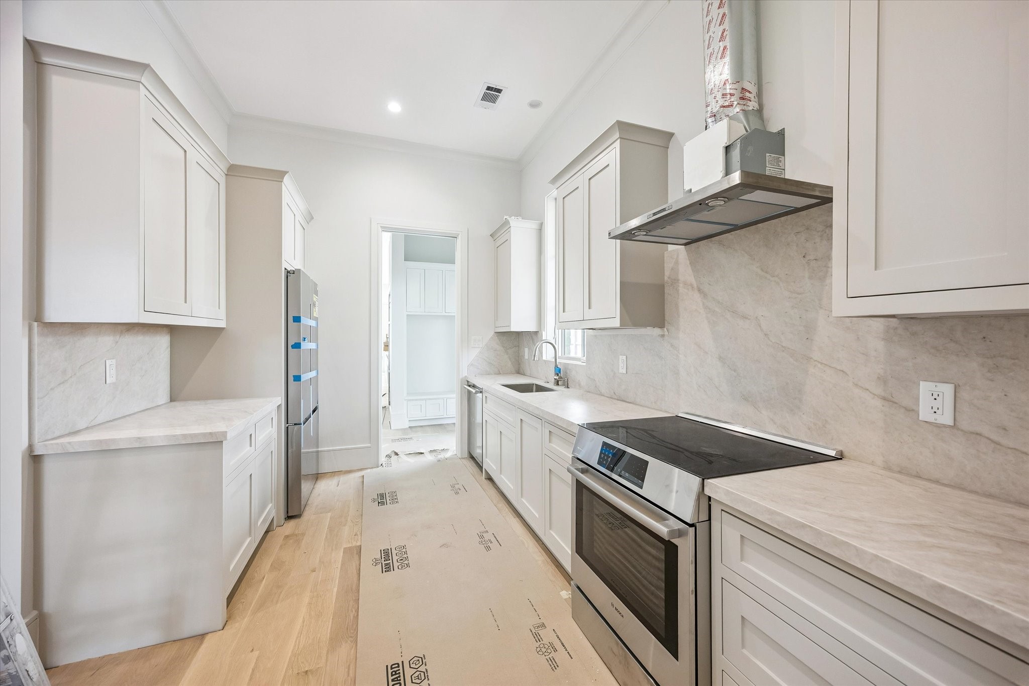 6011 Stones Throw Road Houston, TX 77057 - Photo 11 of 23 Scullery kitchen – provides additional prep space, ample cabinetry, and convenient storage.