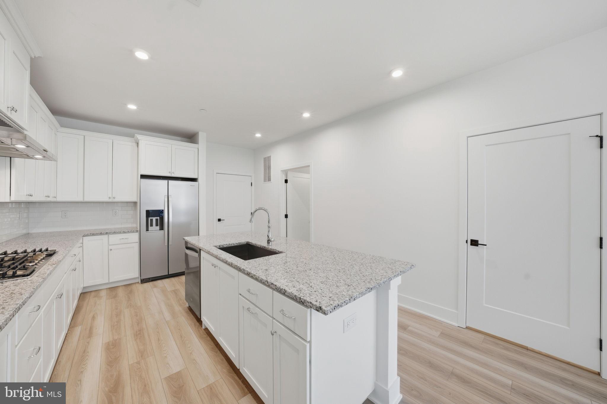 8101 Donatello Drive Princeton, NJ 08540 - Photo 11 of 26 a kitchen with a sink stove and refrigerator