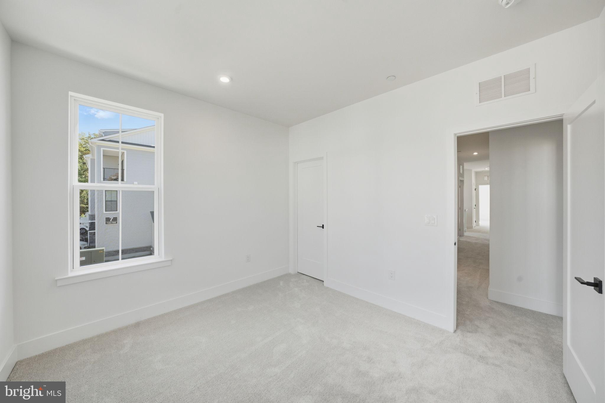 8101 Donatello Drive Princeton, NJ 08540 - Photo 17 of 26 an empty room with windows and closet