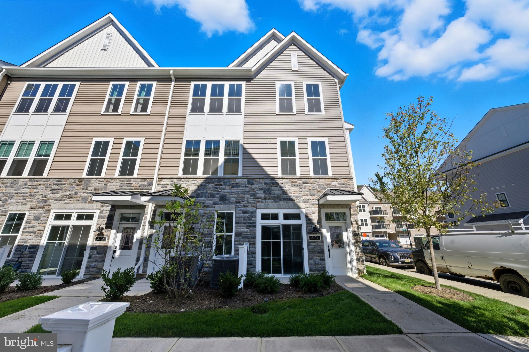 8101 Donatello Drive Princeton, NJ 08540 - Photo 3 of 26 a front view of a house with a yard