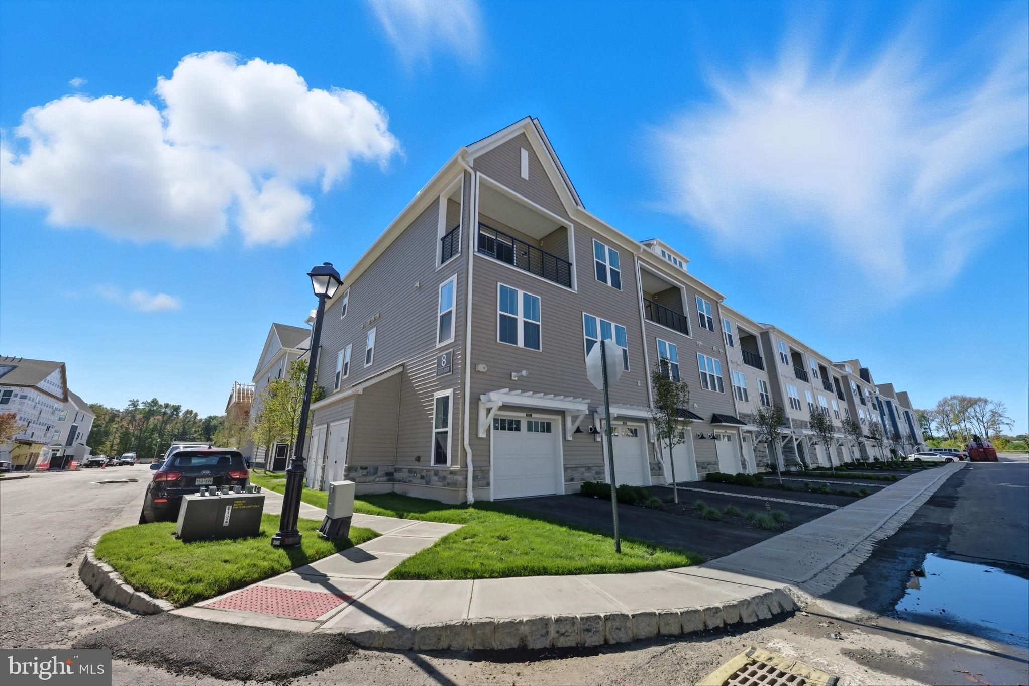 8101 Donatello Drive Princeton, NJ 08540 - Photo 4 of 26 a front view of a house with garden