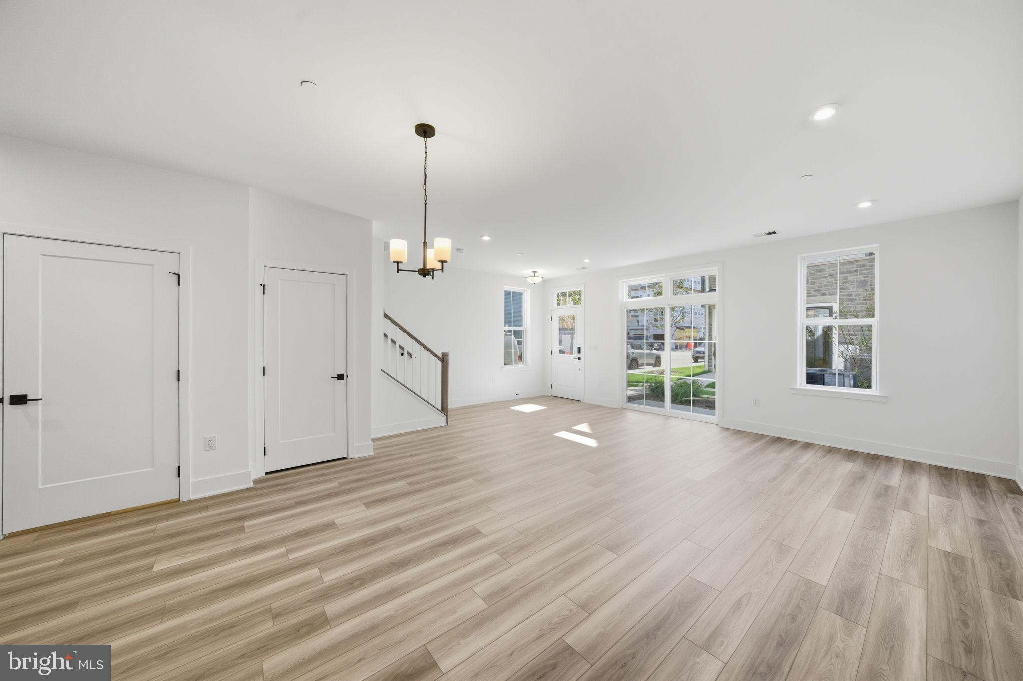 8101 Donatello Drive Princeton, NJ 08540 - Photo 6 of 26 a view of a livingroom with wooden floor and a ceiling fan