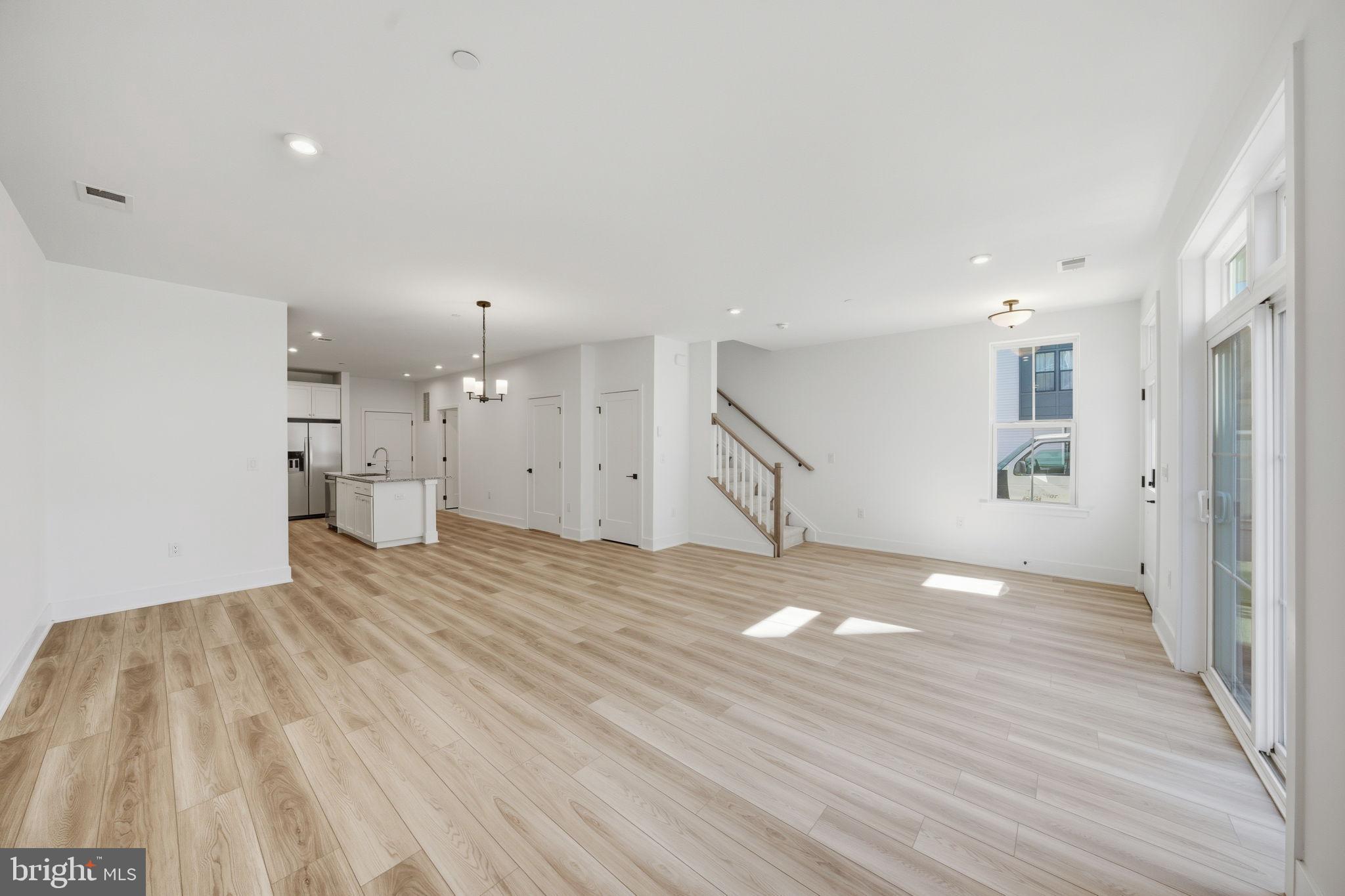 8101 Donatello Drive Princeton, NJ 08540 - Photo 7 of 26 a view of empty room with wooden floor