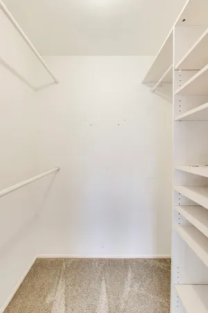 a view of an empty walk in closet