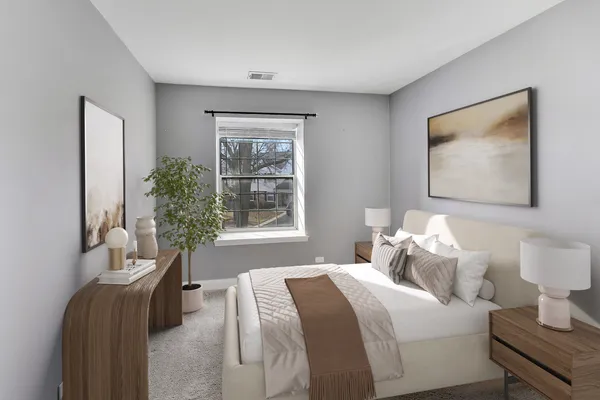 a bedroom with bed and a window