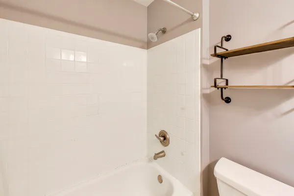 a bathroom with a shower and a bathtub