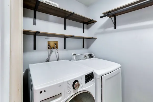 a utility room with dryer and washer