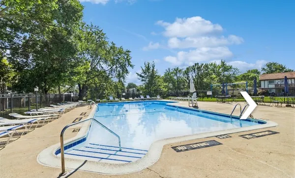 a view of a swimming pool with a lounge chair