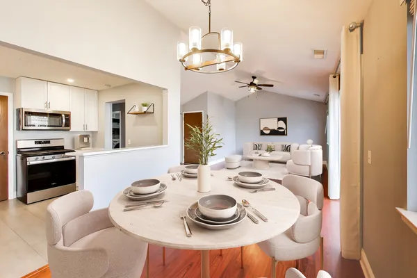 a dining room with furniture a window and kitchen view