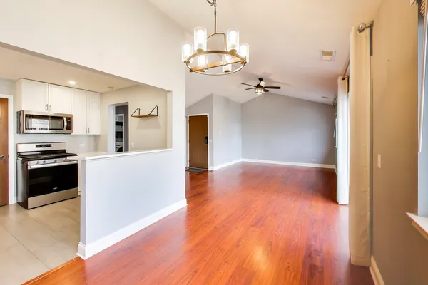 a view of a kitchen with a sink wooden floor and a kitchen