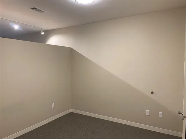 a kitchen with a stove and a refrigerator