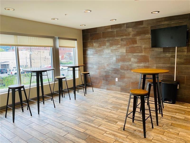 1655 Fifth Avenue, Unit 309 Pittsburgh, PA 15219 - Photo 7 of 16 a view of a livingroom with furniture window and outside view