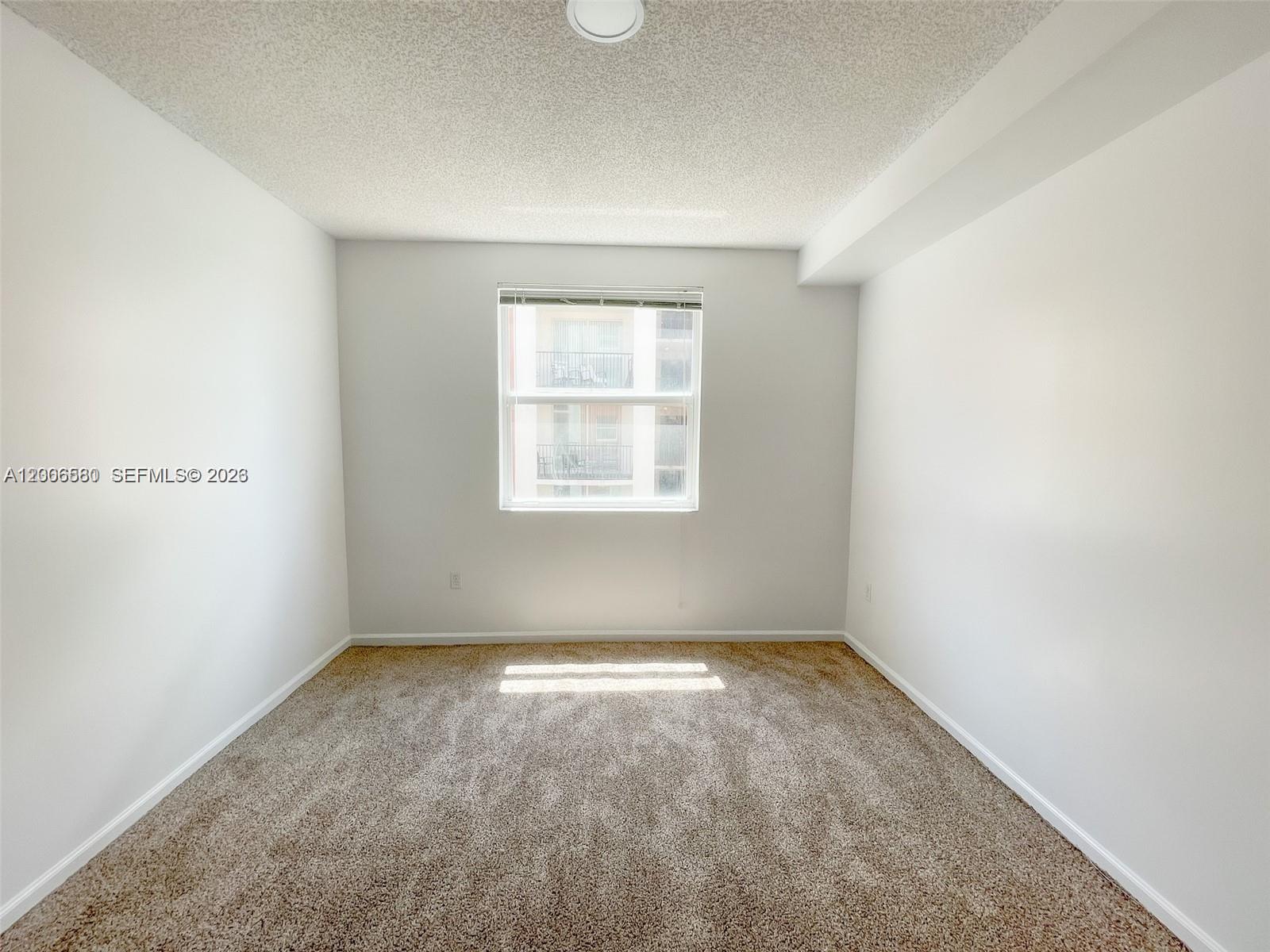 17150 North Bay Road, Unit 2602 Sunny Isles Beach, FL 33160 - Photo 18 of 27 an empty room with a window