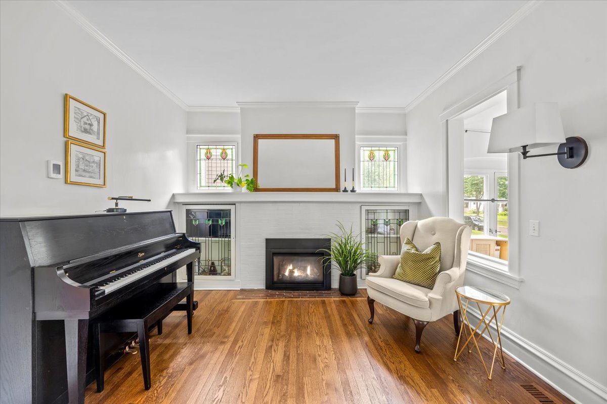 1303 Maple Avenue Wilmette, IL 60091 - Photo 14 of 33 a living room with furniture and a fireplace