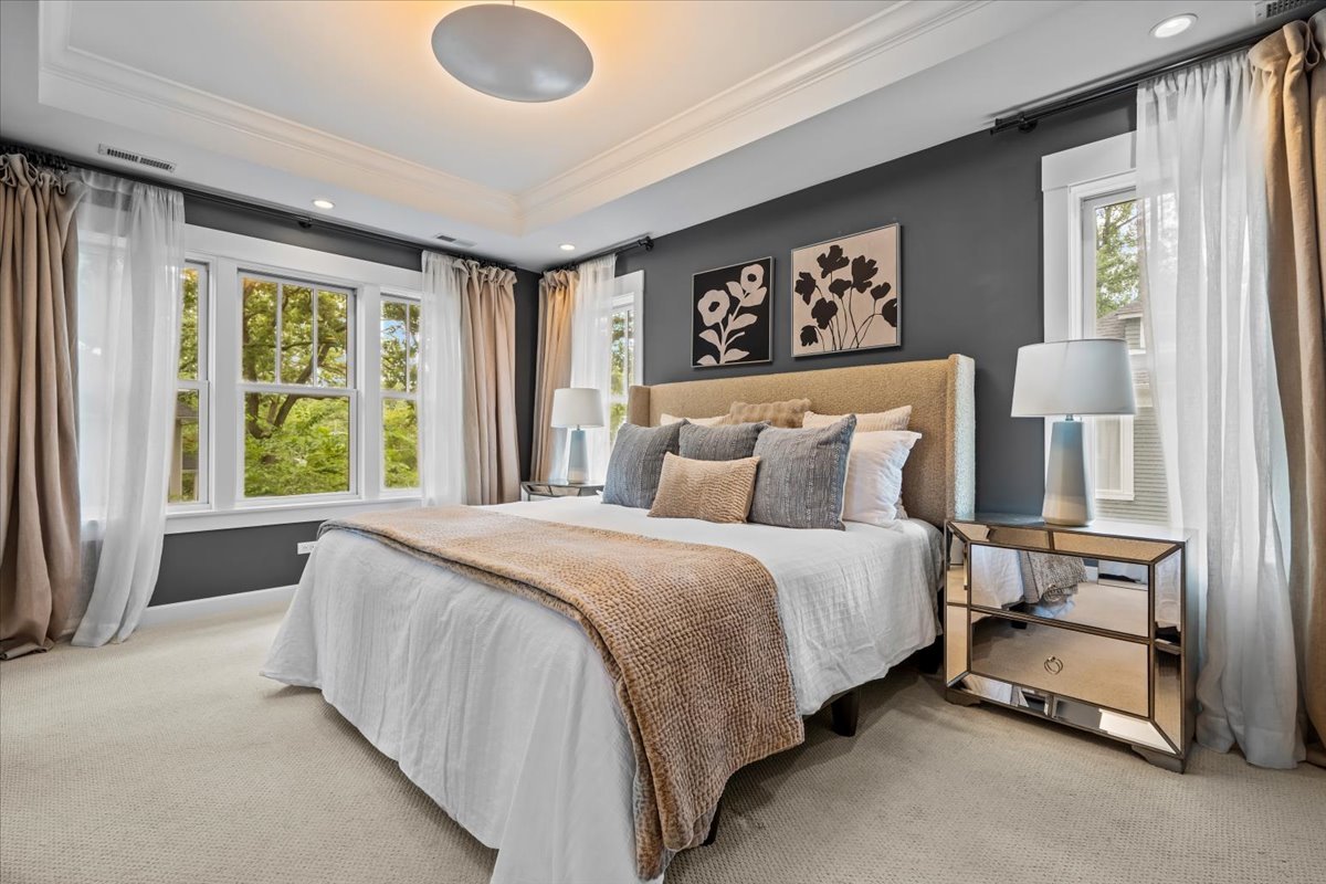 1303 Maple Avenue Wilmette, IL 60091 - Photo 20 of 33 a bed sitting in a spacious bedroom next to a window