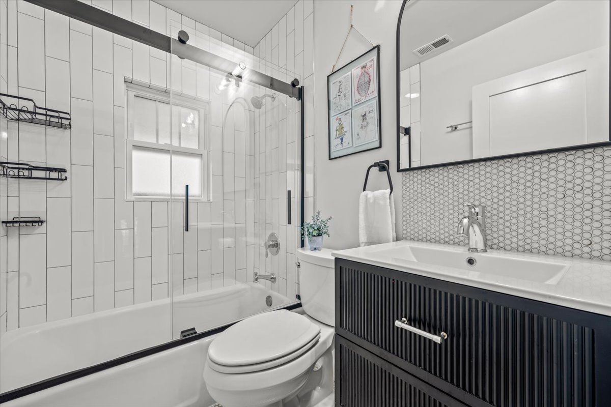 1303 Maple Avenue Wilmette, IL 60091 - Photo 28 of 33 a bathroom with a sink toilet and shower