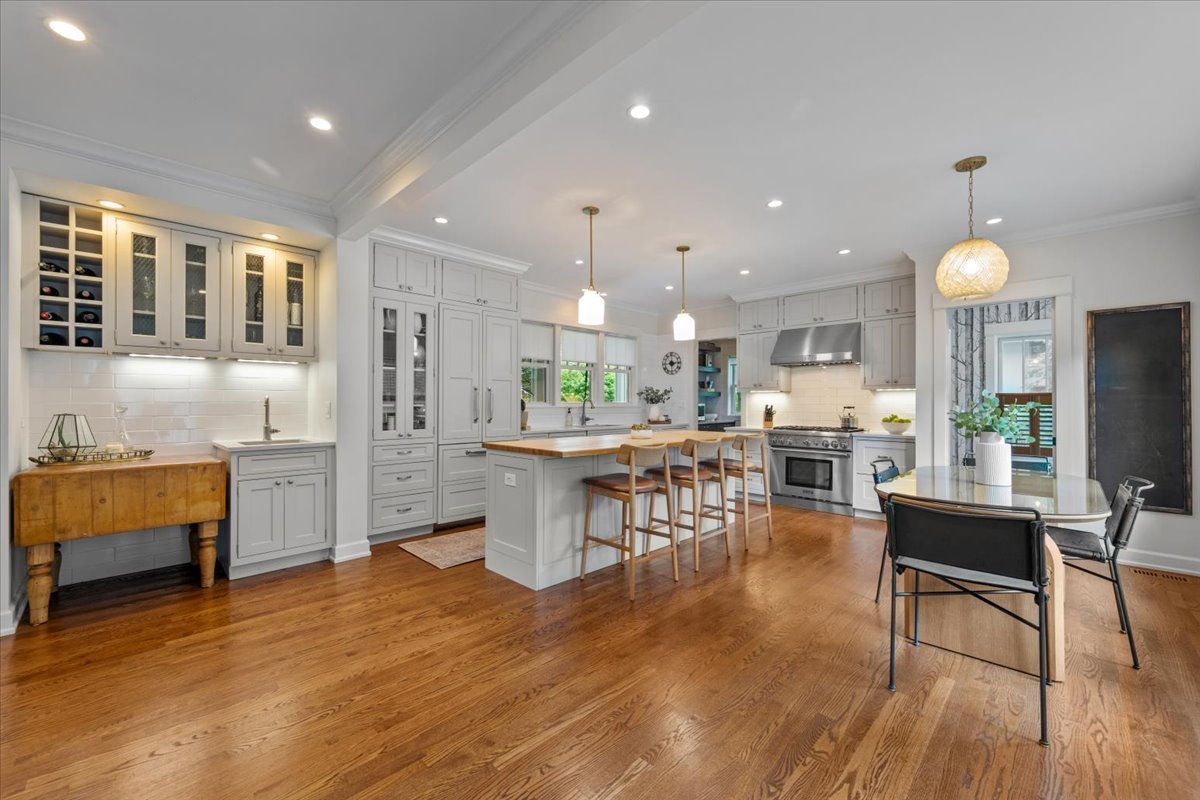 1303 Maple Avenue Wilmette, IL 60091 - Photo 4 of 33 a open kitchen with white cabinets and stainless steel appliances