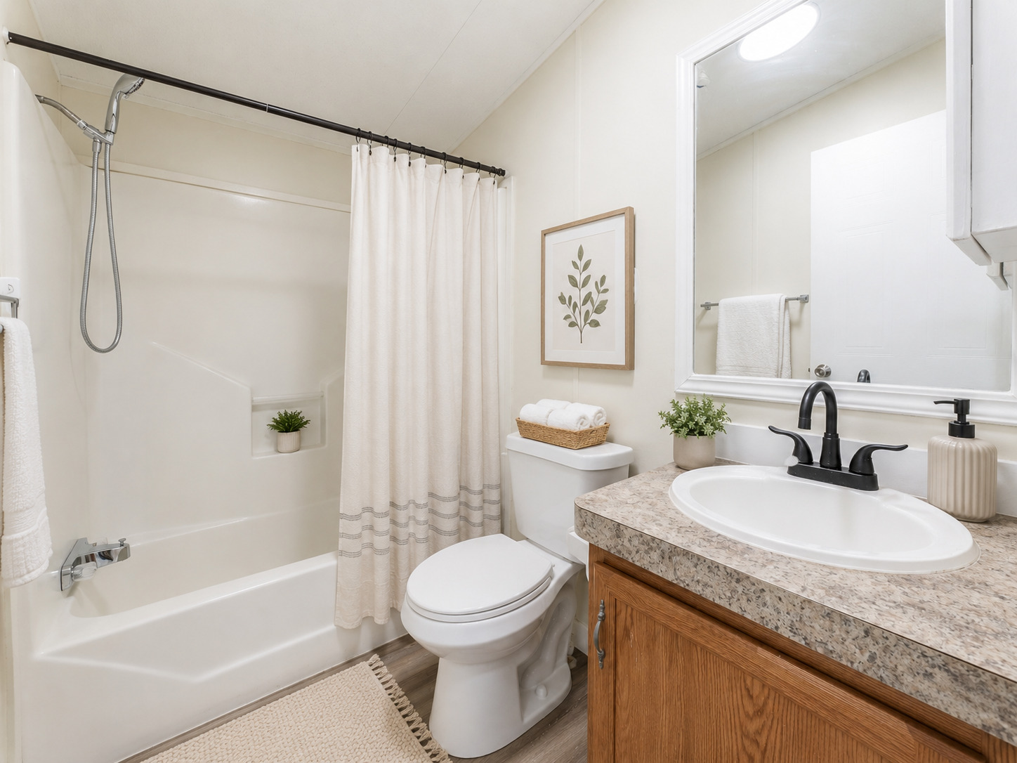 171 Railyard Drive Kyle, TX 78640 - Photo 18 of 20 a bathroom with a granite countertop sink a toilet and shower