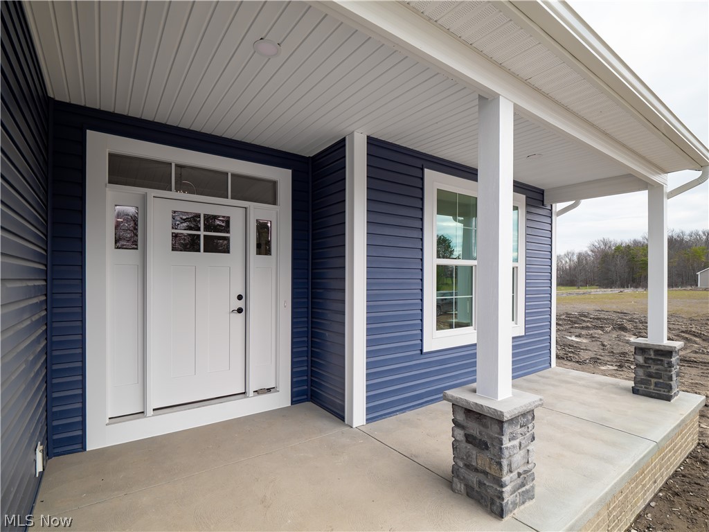 34270 Brookside Lane North Ridgeville, OH 44039 - Photo 7 of 50 Property entrance featuring a porch