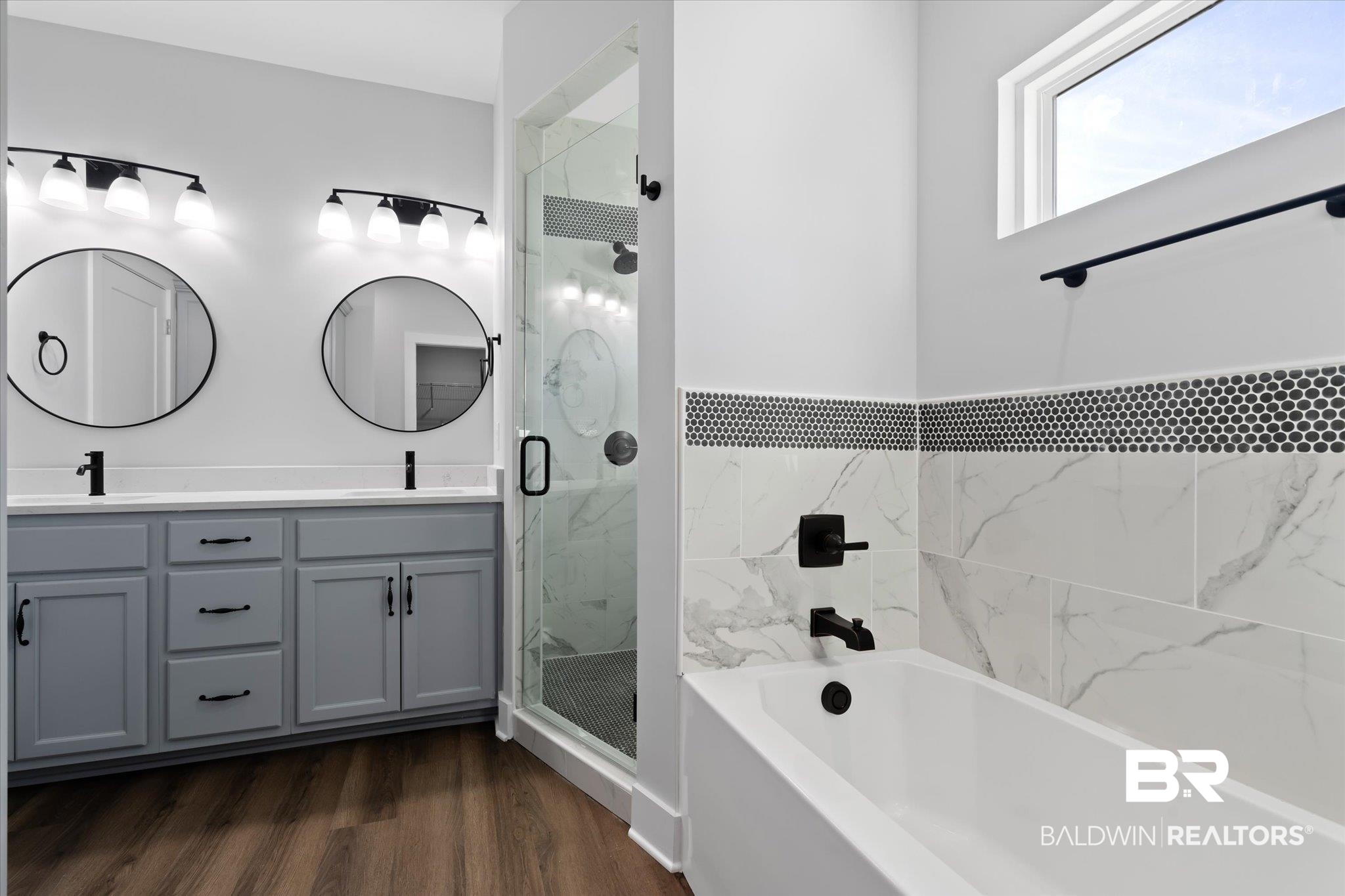 18151 Hoiles Street Robertsdale, AL 36567 - Photo 10 of 23 Bathroom featuring hardwood / wood-style flooring, vanity, and independent shower and bath