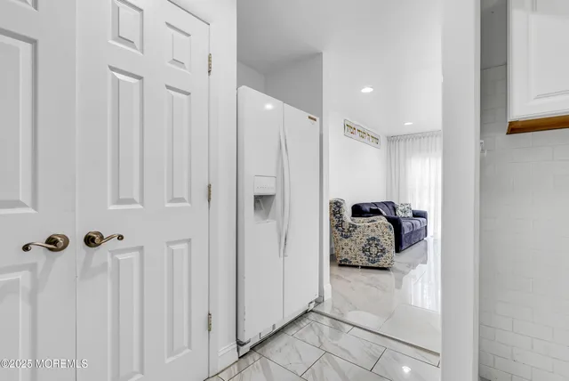 a bathroom with a glass door shower