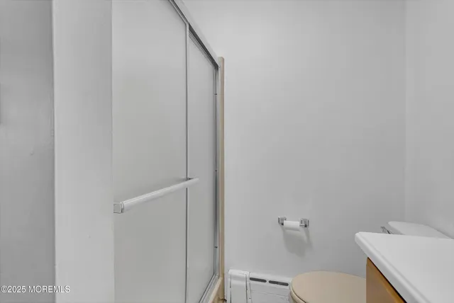 a bedroom with double bed and a window