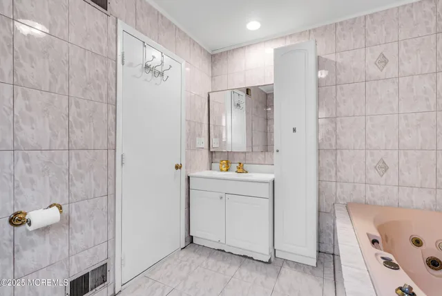 a bathroom with a bathtub and shower