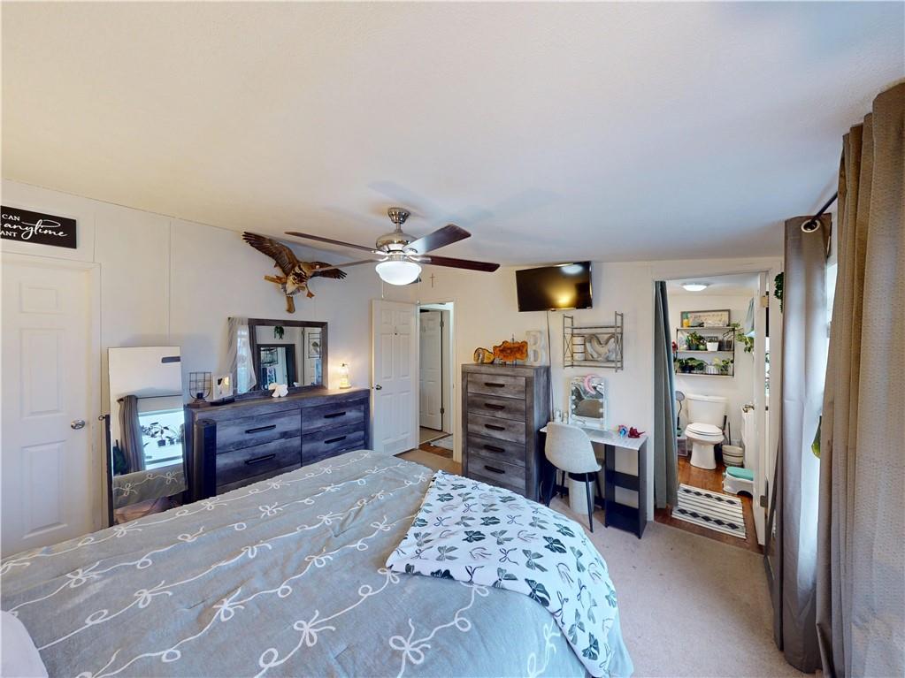 145 Boomerang Road Harrisville, PA 16038 - Photo 16 of 37 a bedroom with a bed dresser and a large window