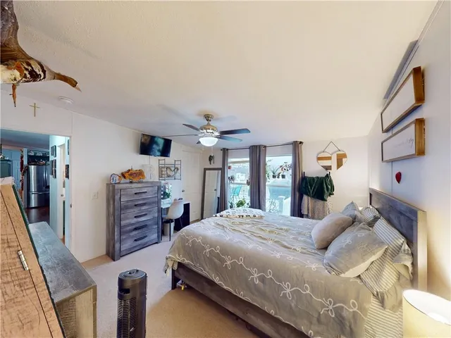 a bedroom with baby toys and wooden floor