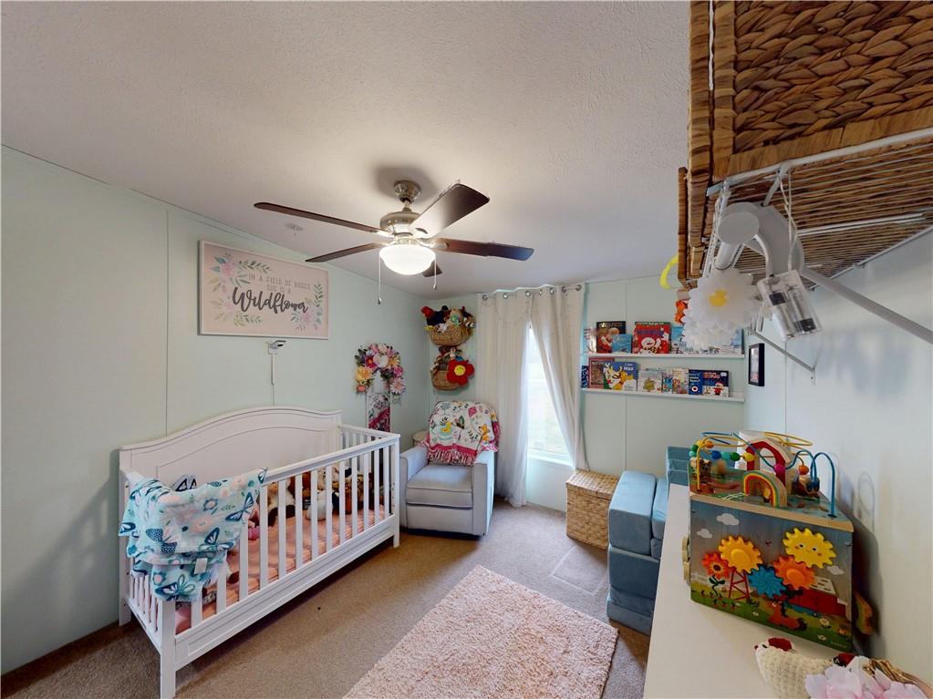 145 Boomerang Road Harrisville, PA 16038 - Photo 20 of 37 a bedroom with furniture and a baby crib
