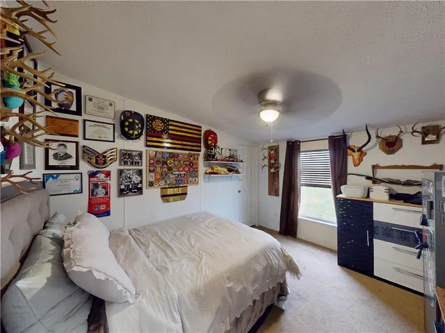 a bedroom with a bed and a bathroom