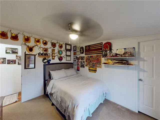a view of a roof deck with table and chairs a stove with wooden floor