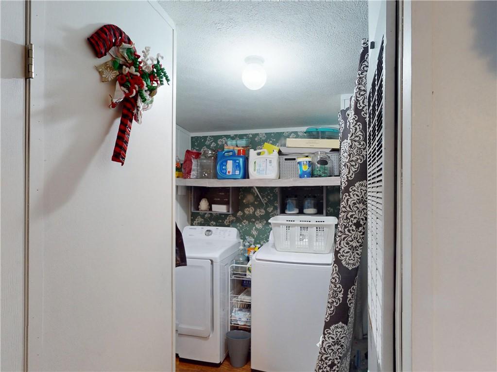 145 Boomerang Road Harrisville, PA 16038 - Photo 26 of 37 a room with storage and utility