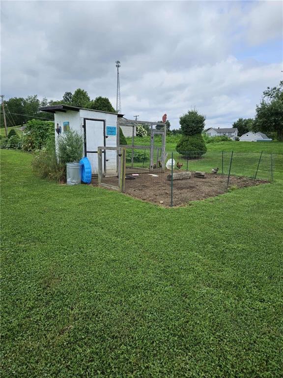 145 Boomerang Road Harrisville, PA 16038 - Photo 32 of 37 a view of a house with a backyard