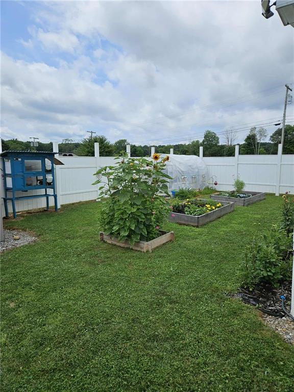 145 Boomerang Road Harrisville, PA 16038 - Photo 34 of 37 a view of a garden with an outdoor seating