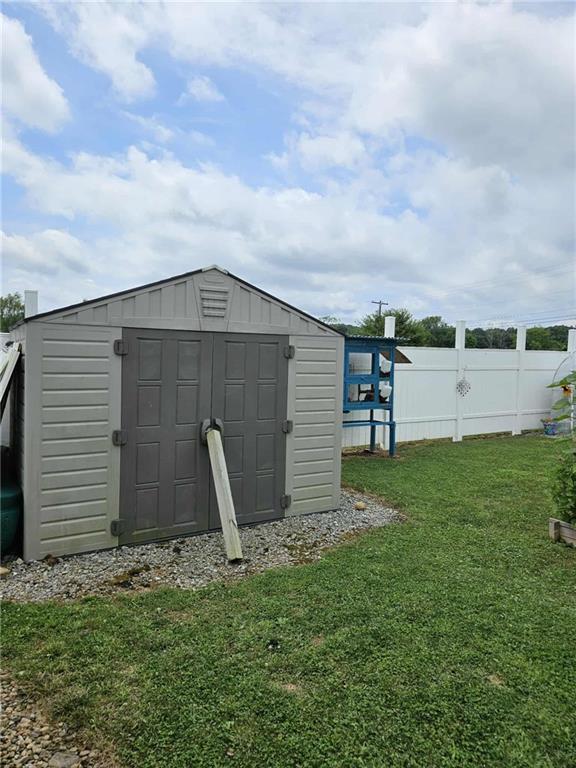 145 Boomerang Road Harrisville, PA 16038 - Photo 37 of 37 a backyard of a house with lots of green space and garden