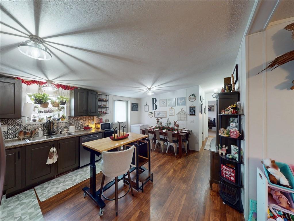 145 Boomerang Road Harrisville, PA 16038 - Photo 7 of 37 a room with lots of furniture and clutter