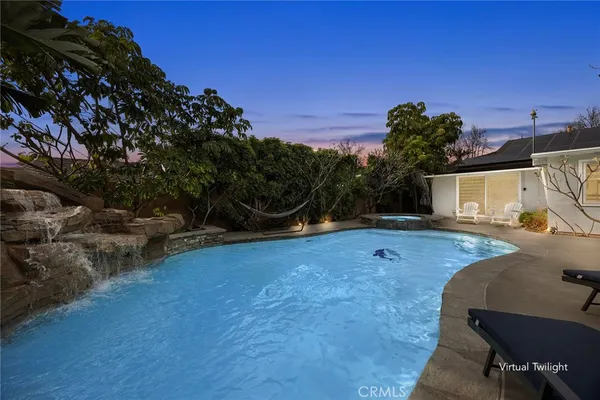a view of a backyard with sitting area