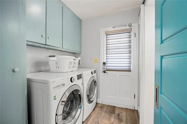 a kitchen with granite countertop stainless steel appliances cabinets a sink and a counter top space